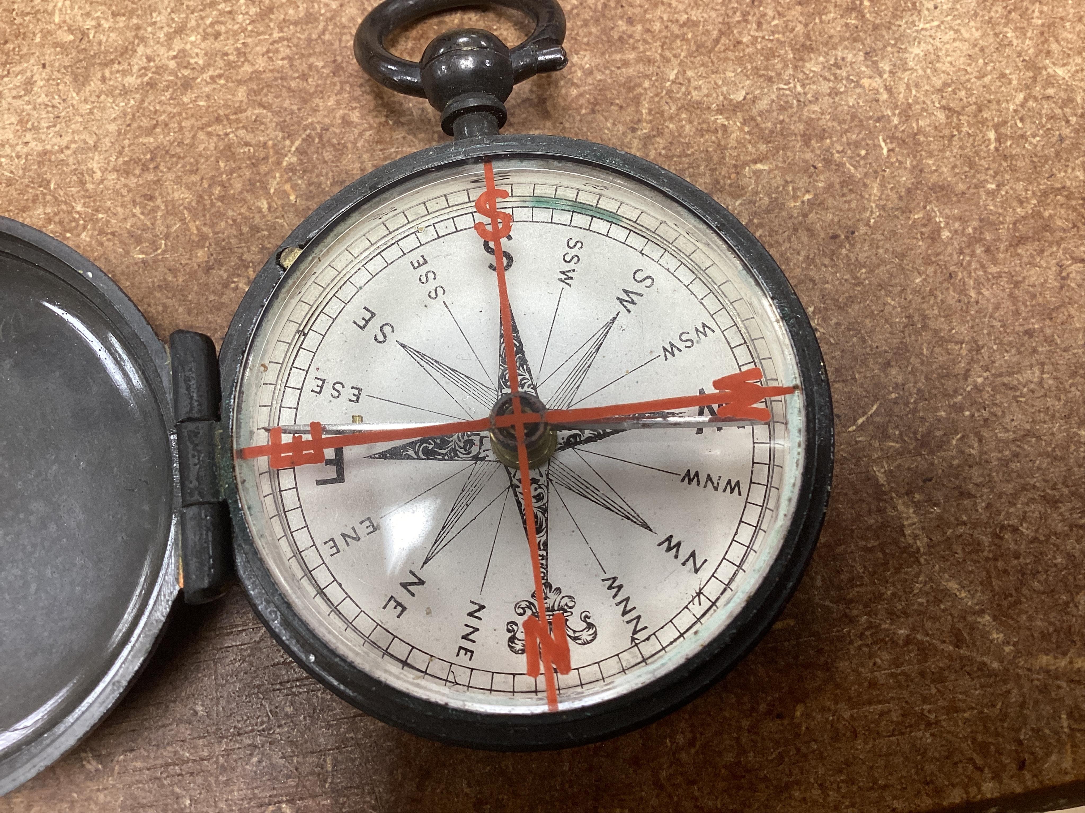Two pocket damp detectors, a pocket barometer, and a compass, three with original leather cases. Condition - fair